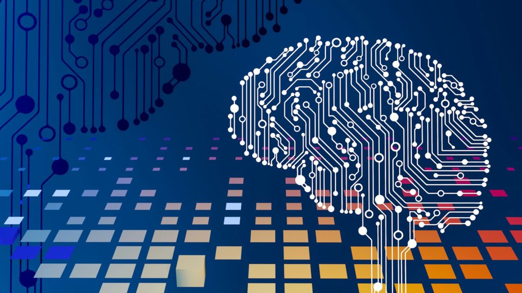 Ilustrace obvodů ve tvaru lidského mozku symbolizující umělou inteligenci a strojové učení na tmavě modrém pozadí.